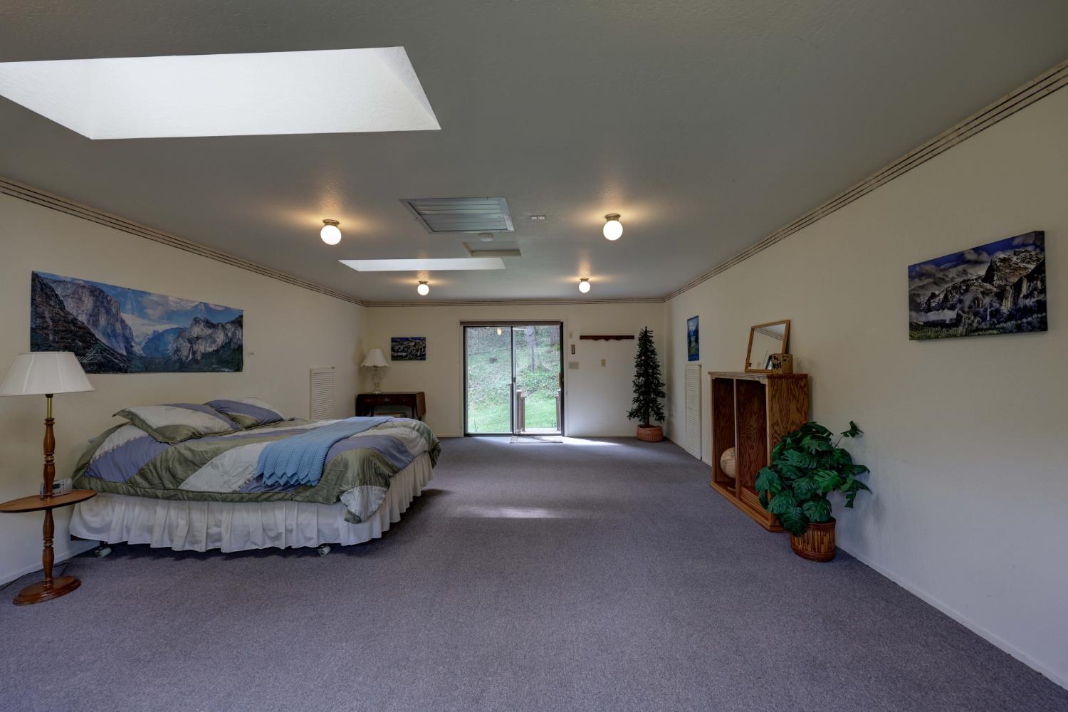 409 Live Oak Road Colfax, CA 95713 - Photo 48 of 74 How will you use this room over the garage? Check out the 4 closets doors that go into some great attic storage. The next 3 photos are of options for this room.
