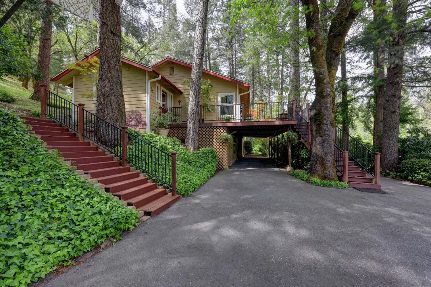 409 Live Oak Road Colfax, CA 95713 - Photo 10 of 74 As you reach the top of the driveway the home is on your right and the garage is on your left, next photo. For moving in or moving large items, or assisting a friend who doesn't negotiate stairs well, the sellers have an access behind the garaage that goes up to the home and 2nd story of garage. It is across grass.