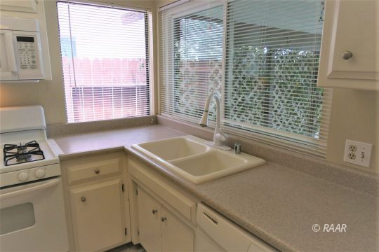 440 Debra Lane Ridgecrest, CA 93555 - Photo 12 of 32 a bathroom with a sink and a window
