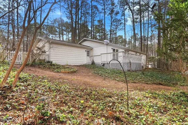 a backyard of a house with lots of green space