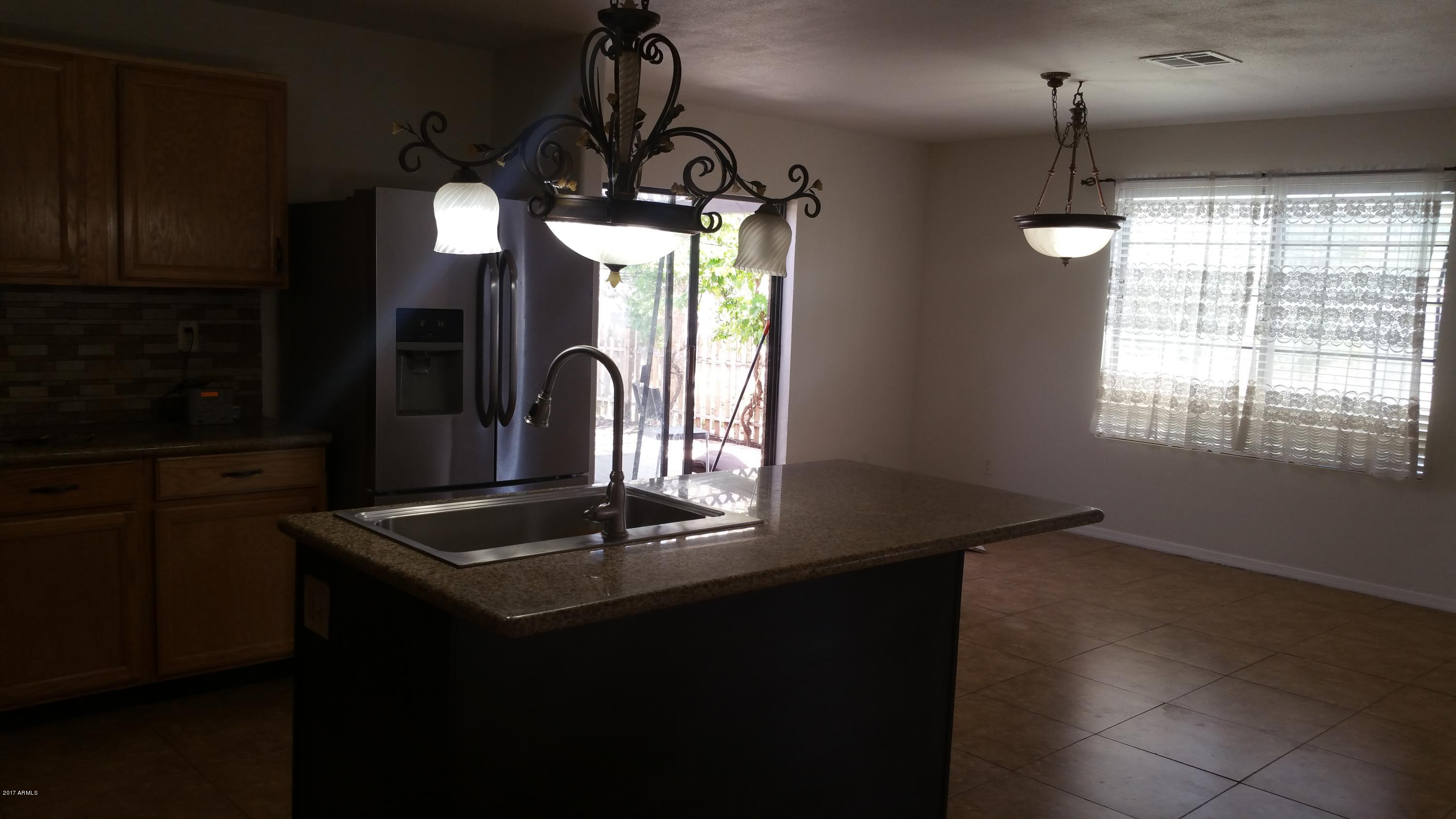 6039 South 46th Street Phoenix, AZ 85042 - Photo 14 of 16 Kitchen View of Backdoor