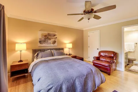 a bedroom with a bed and dresser