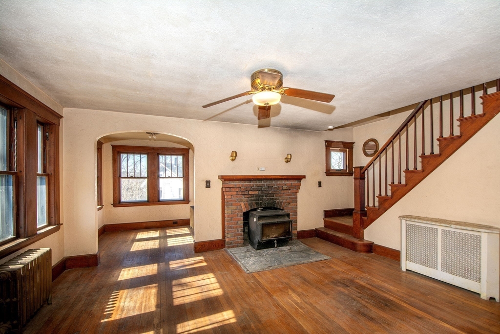 86 Westminster Road Weymouth, MA 02189 - Photo 12 of 15 a view of livingroom with furniture fireplace and windows