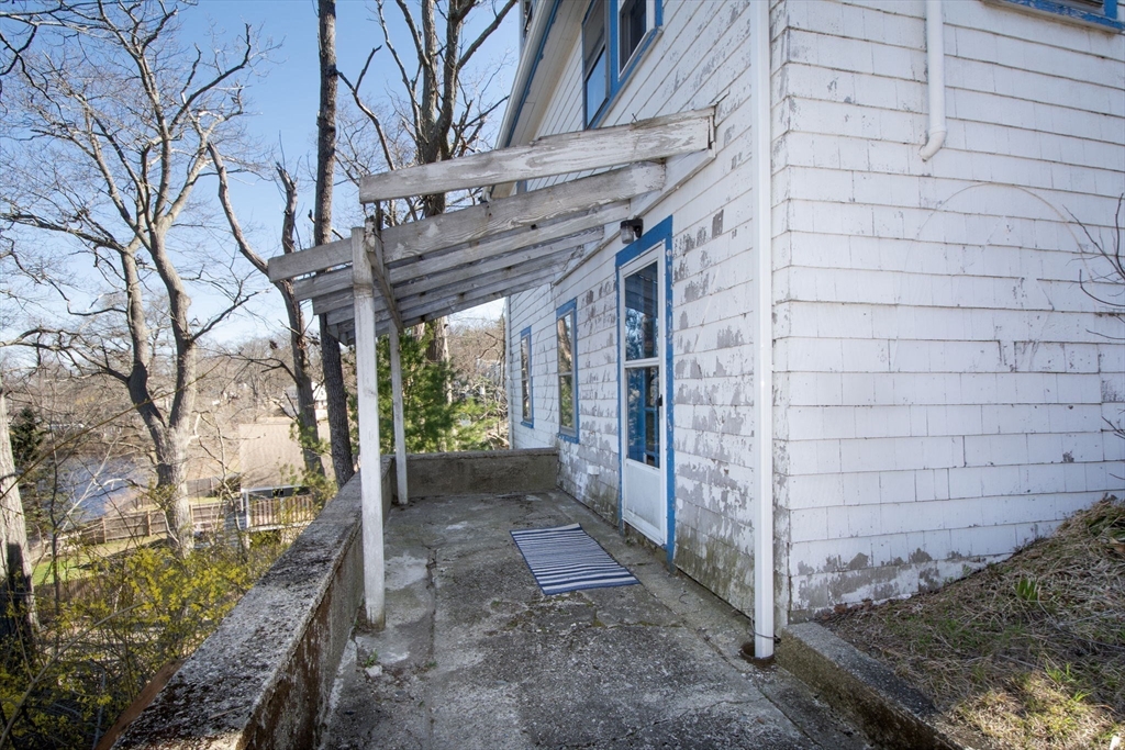 86 Westminster Road Weymouth, MA 02189 - Photo 4 of 15 a view of a pathway with a tree