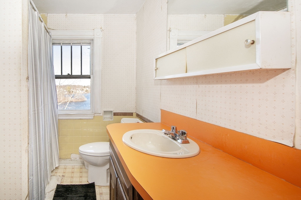 86 Westminster Road Weymouth, MA 02189 - Photo 7 of 15 a bathroom with a sink and a mirror