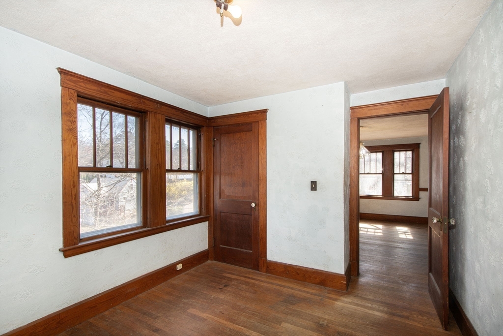 86 Westminster Road Weymouth, MA 02189 - Photo 8 of 15 an empty room with wooden floor and windows