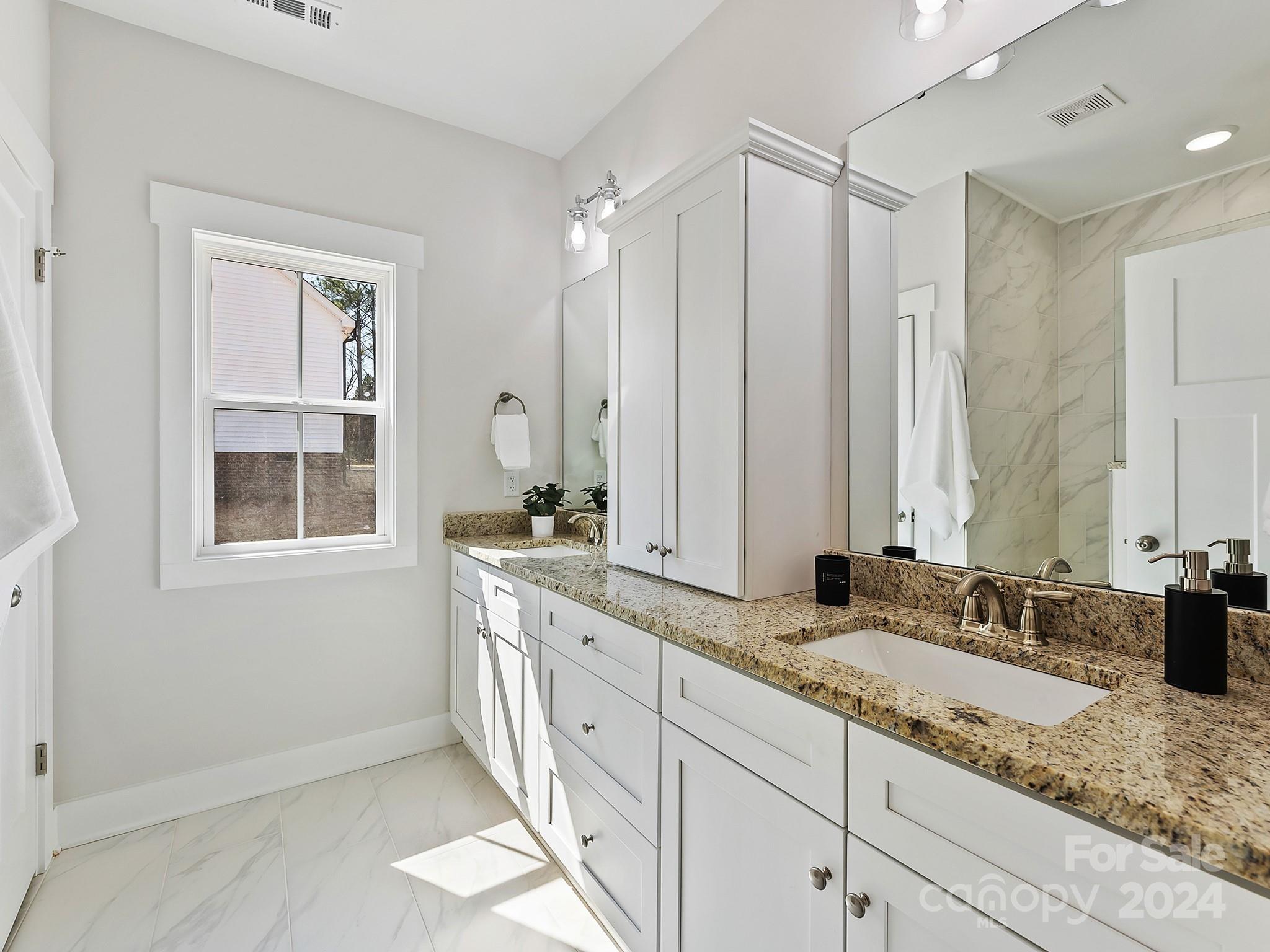 194 Old Pinckney Road York, SC 29745 - Photo 20 of 30 a bathroom with double sink and a mirror