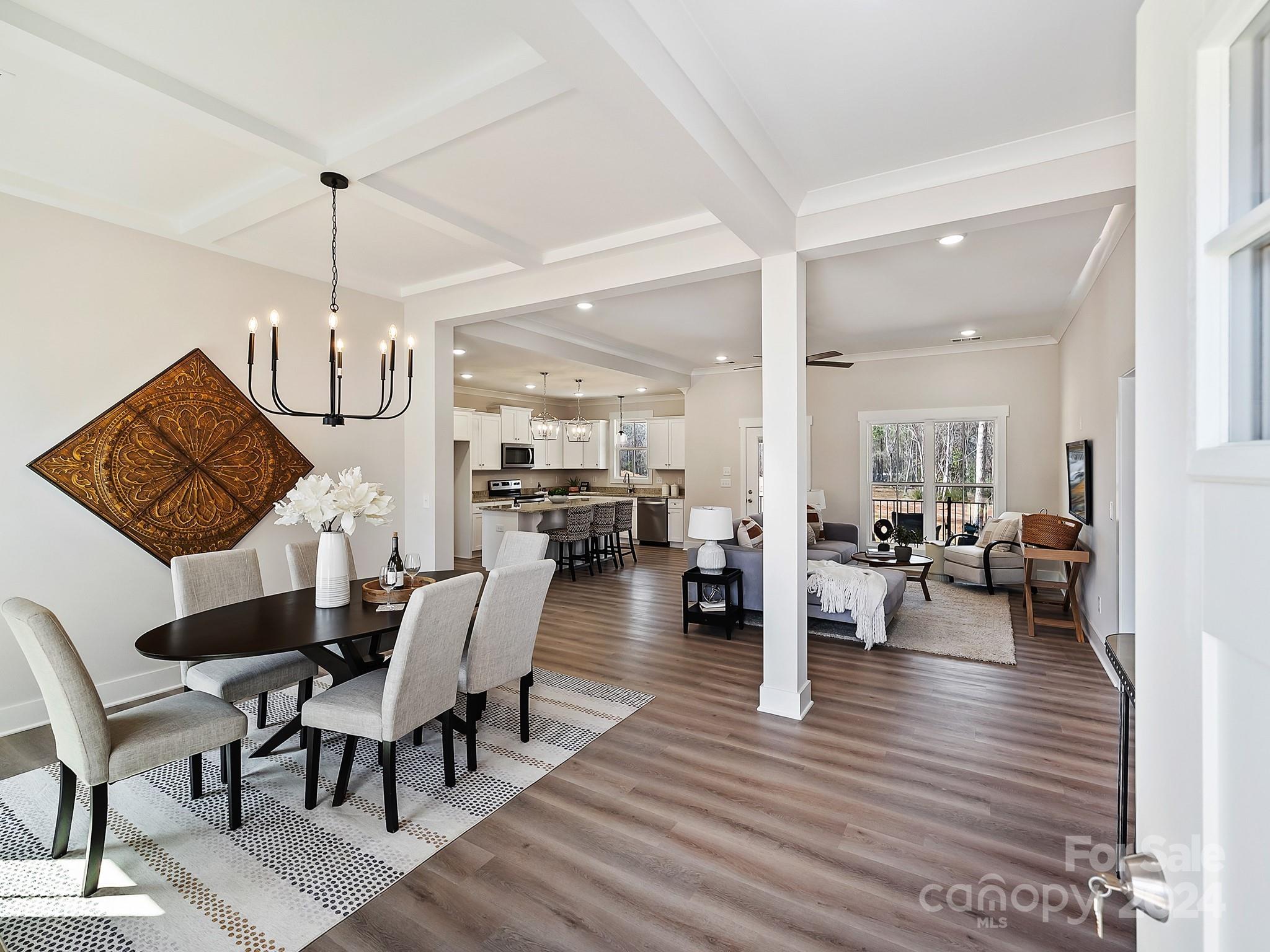 194 Old Pinckney Road York, SC 29745 - Photo 2 of 30 a view of a dining room and livingroom with furniture wooden floor a chandelier