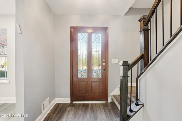 a view of front door with stairs