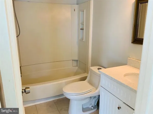 a bathroom with a toilet a sink and a bathtub