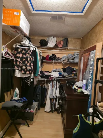 a room with lots of different colored cloths