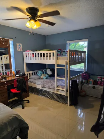 a bedroom with furniture and a fireplace