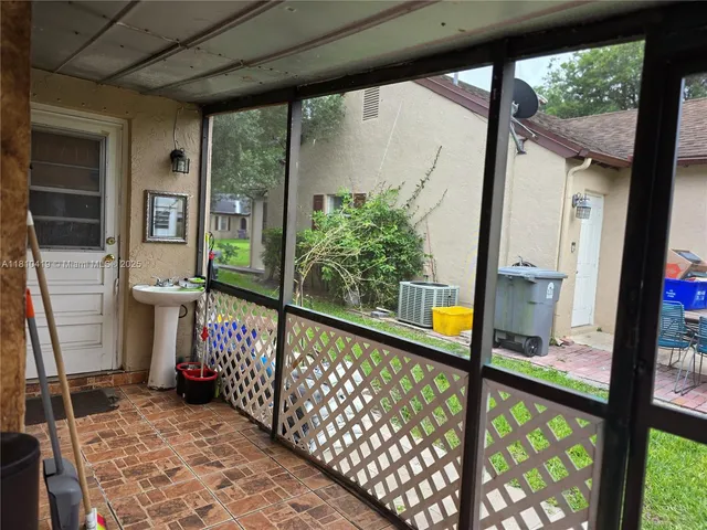 a view of a porch with wooden floor