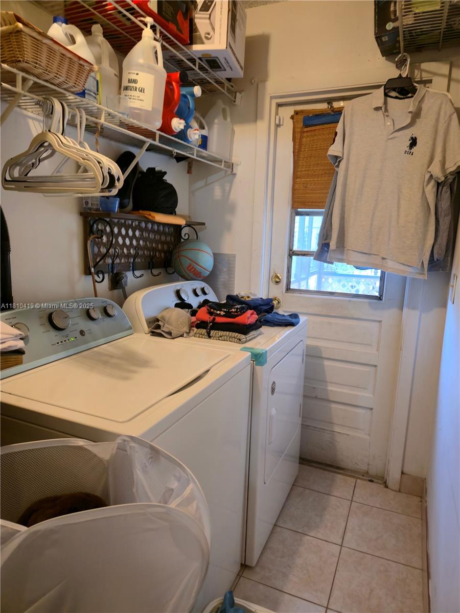 22374 Southwest 57th Circle Boca Raton, FL 33428 - Photo 9 of 31 a utility room with cabinets