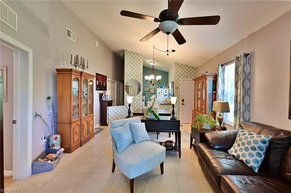 a kitchen with stainless steel appliances granite countertop a sink dishwasher and cabinets with wooden floor