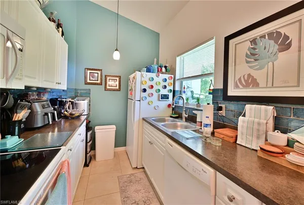 a en suite bathroom with a double vanity sinks and a mirror
