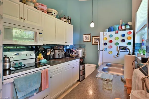 a bed room with a bed and a television