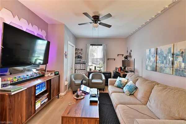 a bathroom with a granite countertop toilet sink and mirror