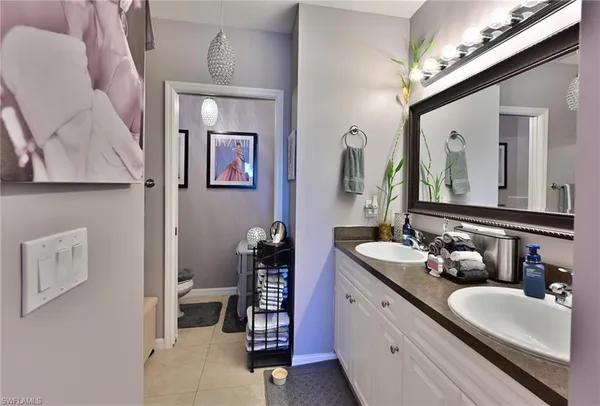 a front view of house with a garden