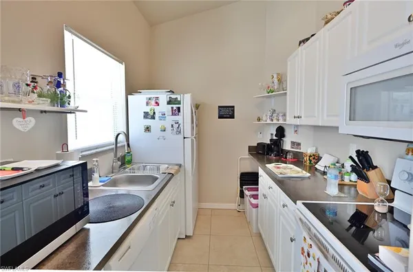a bedroom with a bed and a bookshelf