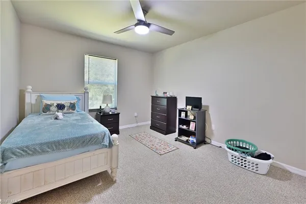 a bathroom with a toilet a sink and a mirror