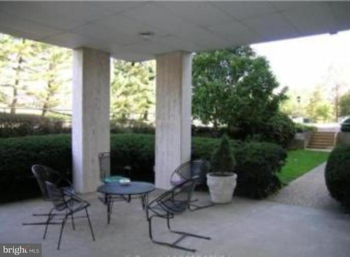 4401 Roland Avenue, Unit 607 Baltimore, MD 21210 - Photo 5 of 16 a view of a patio with chairs and plants