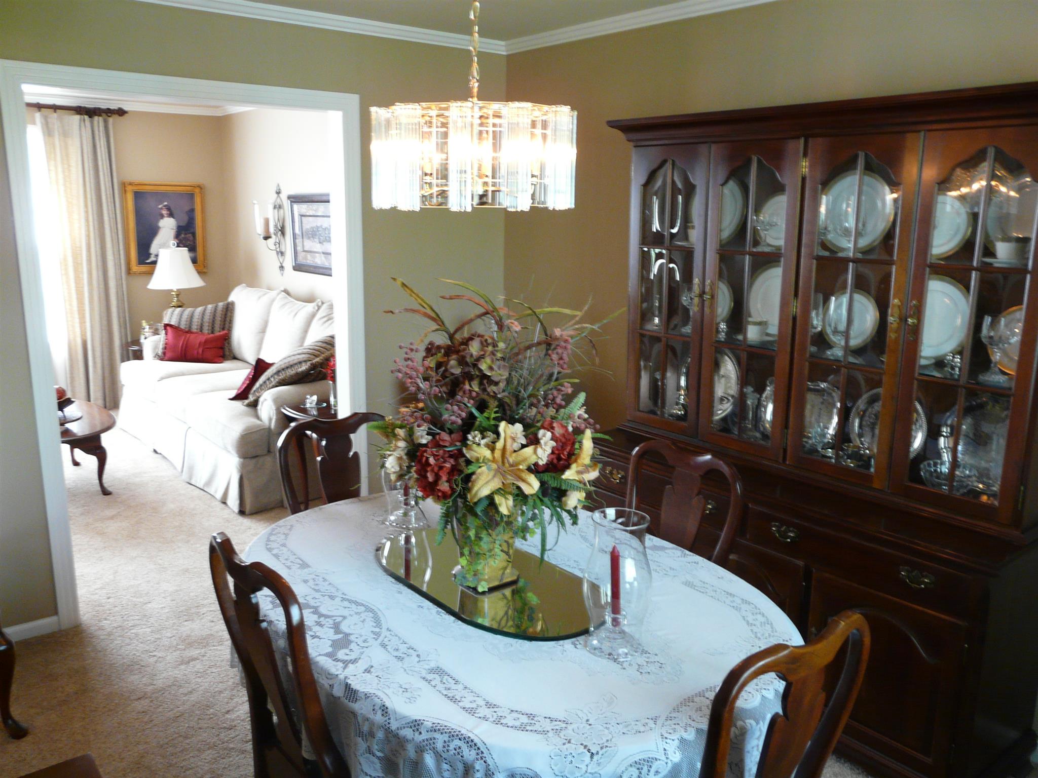 5333 Overton Road Nashville, TN 37220 - Photo 6 of 18 Beautiful dining space open to living room and kitchen with neutral paint color, nice carpet and crown molding.