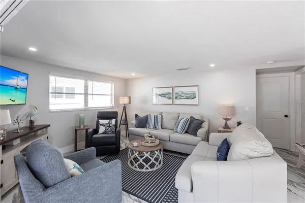a living room with furniture or couch and a window