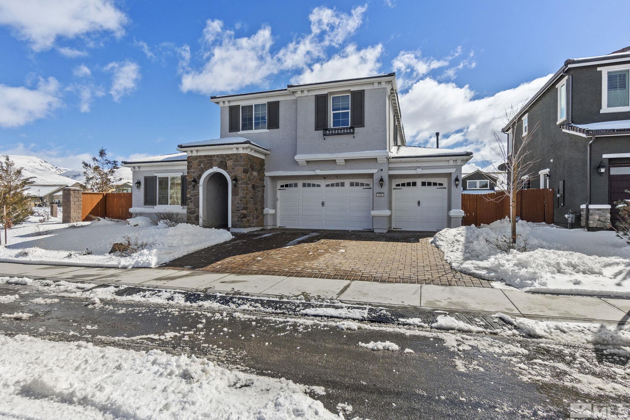 2320 Patayan Road Reno, NV 89521 - Photo 2 of 36 a view of a house with snow on the road