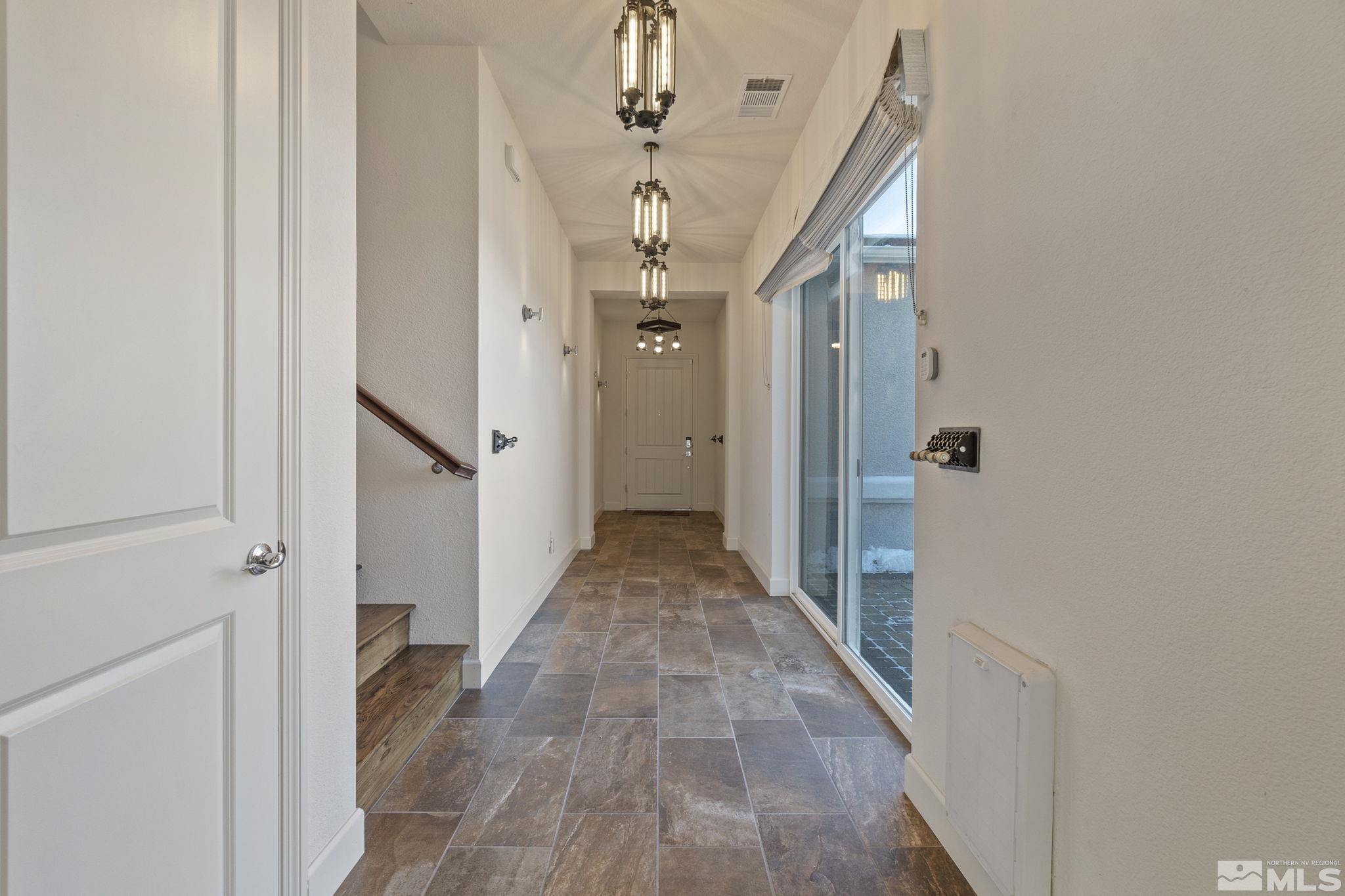 2320 Patayan Road Reno, NV 89521 - Photo 3 of 36 a view of a hallway view with wooden floor and staircase