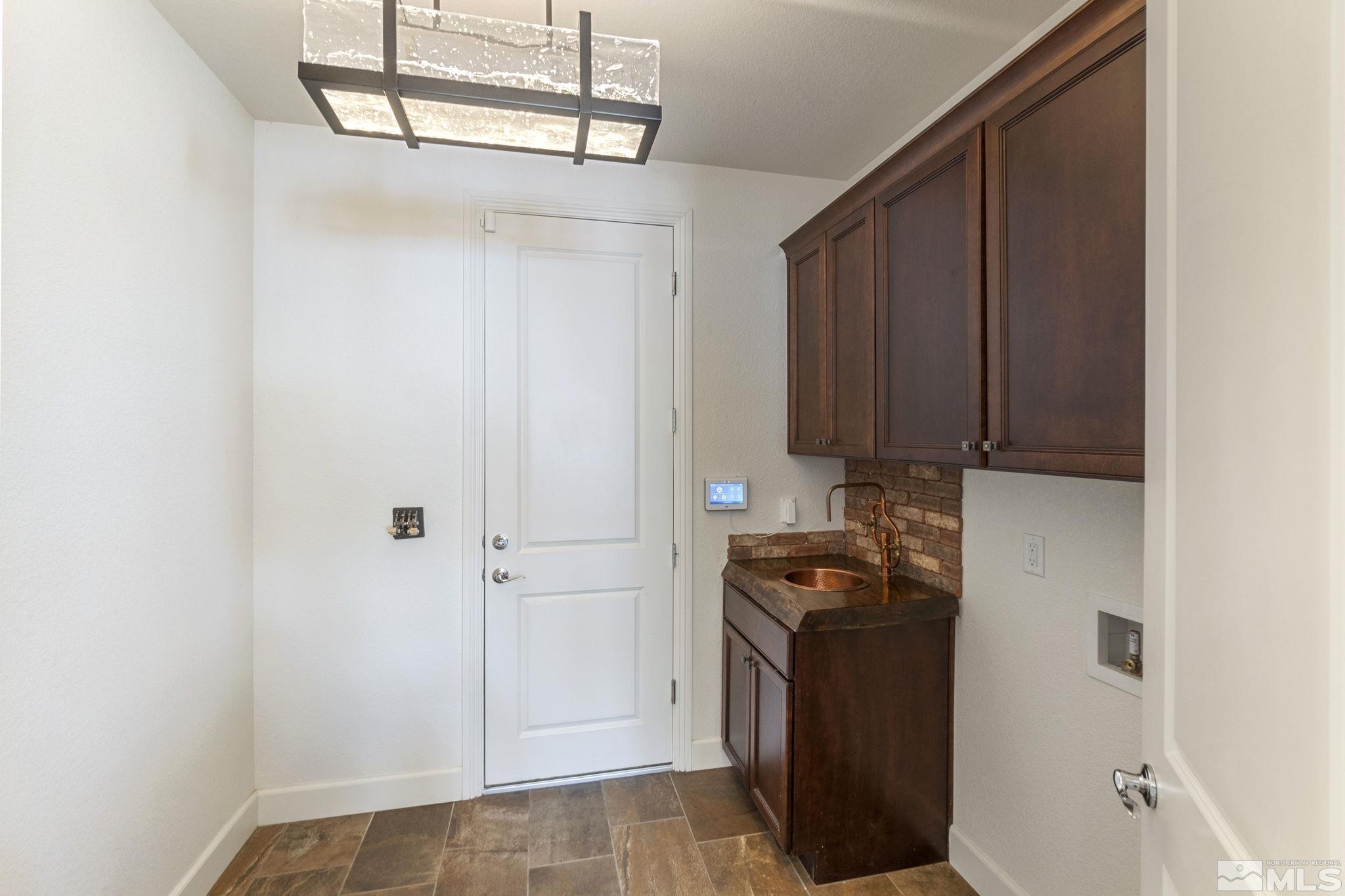 2320 Patayan Road Reno, NV 89521 - Photo 32 of 36 a kitchen with a sink and cabinets
