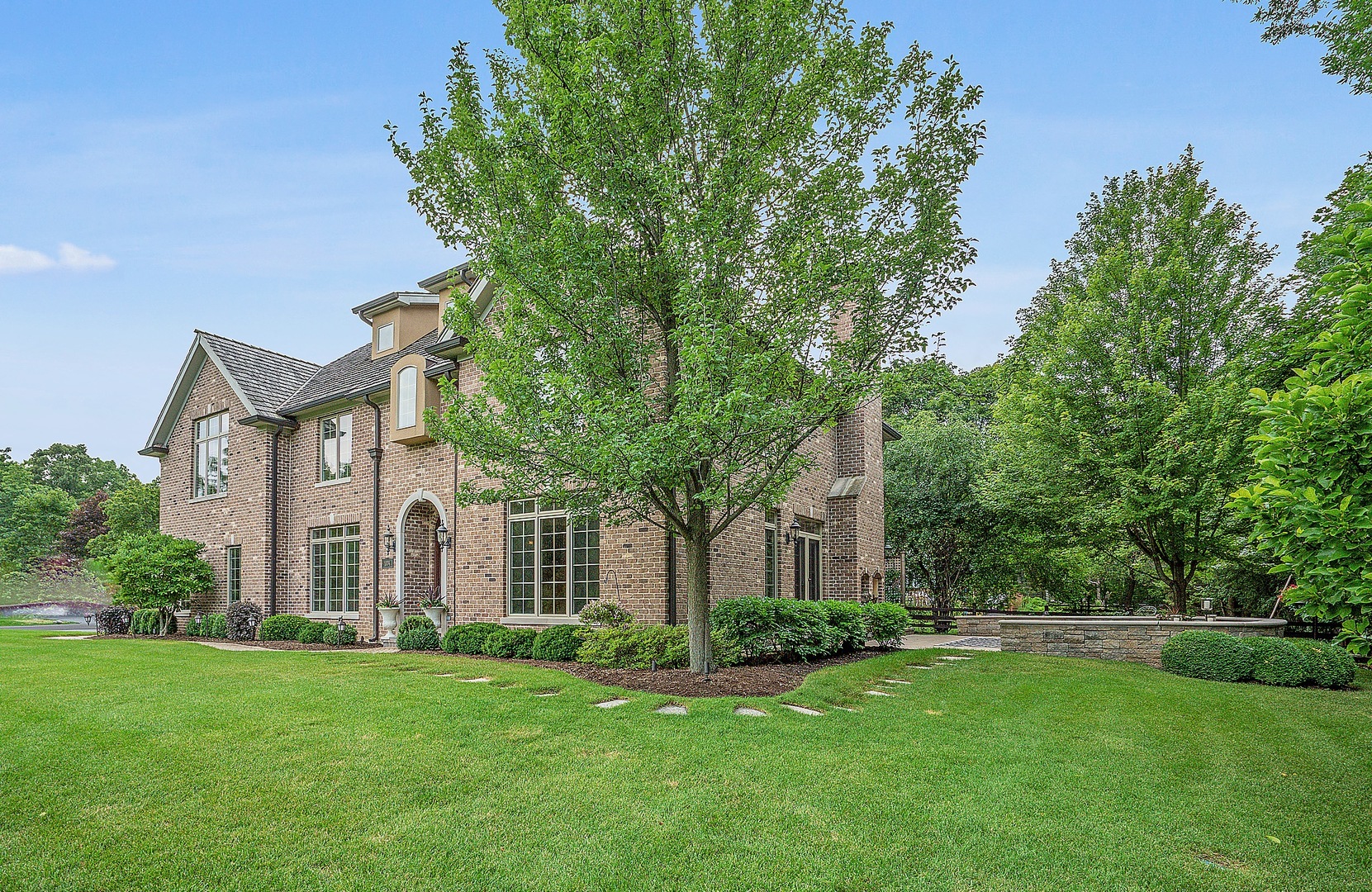 1004 Lee Road Northbrook, IL 60062 - Photo 1 of 30 a front view of a house with a yard