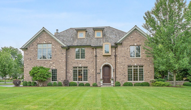 1004 Lee Road Northbrook, IL 60062 - Photo 2 of 30 a front view of a house with a yard