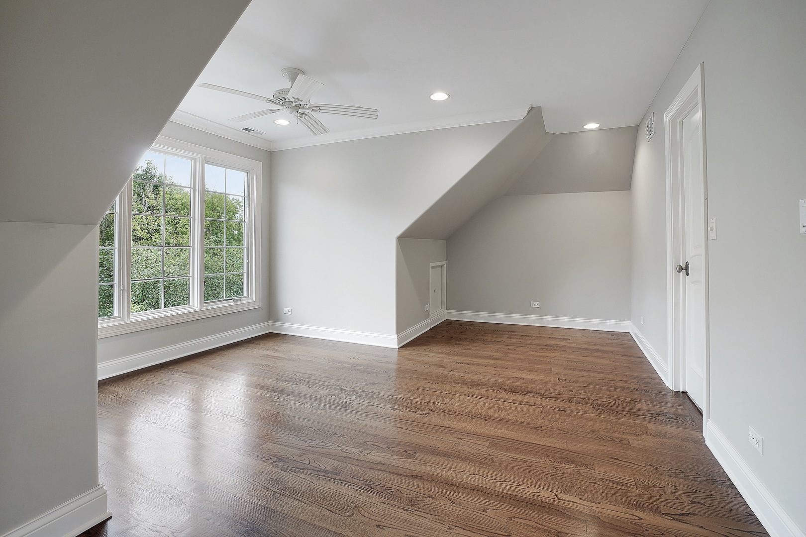 1004 Lee Road Northbrook, IL 60062 - Photo 13 of 30 a view of an empty room with wooden floor and a window
