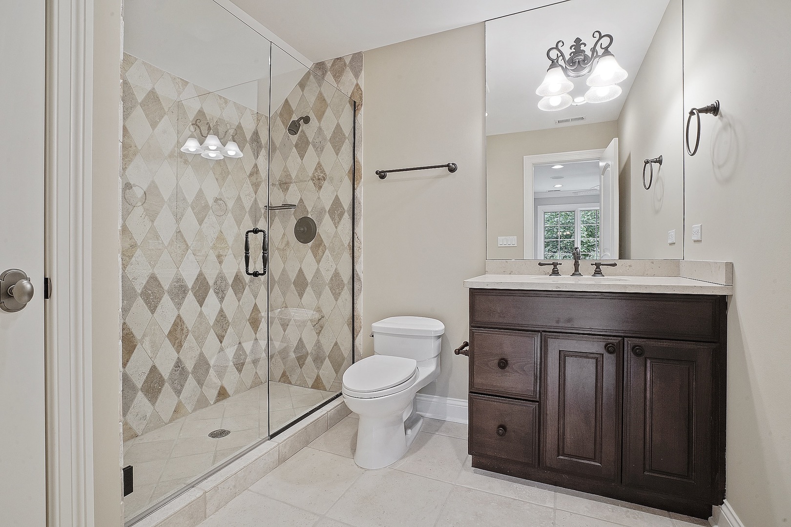 1004 Lee Road Northbrook, IL 60062 - Photo 15 of 30 a bathroom with a sink a toilet and shower