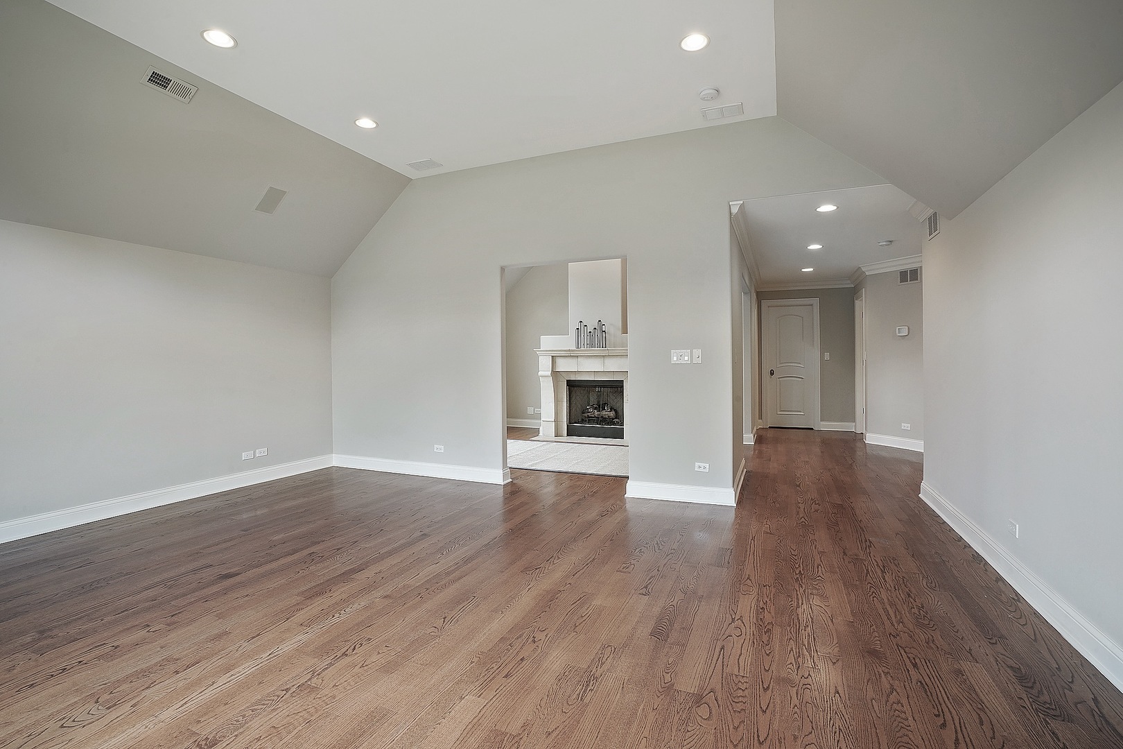 1004 Lee Road Northbrook, IL 60062 - Photo 18 of 30 wooden floor in an empty room with a kitchen