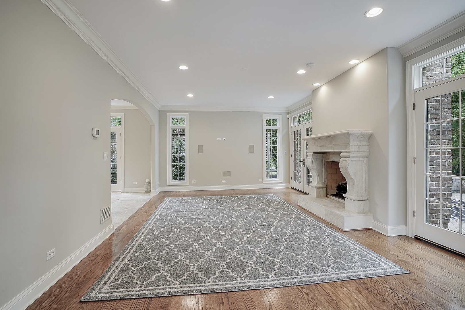 1004 Lee Road Northbrook, IL 60062 - Photo 3 of 30 a view of empty room with wooden floor and fireplace