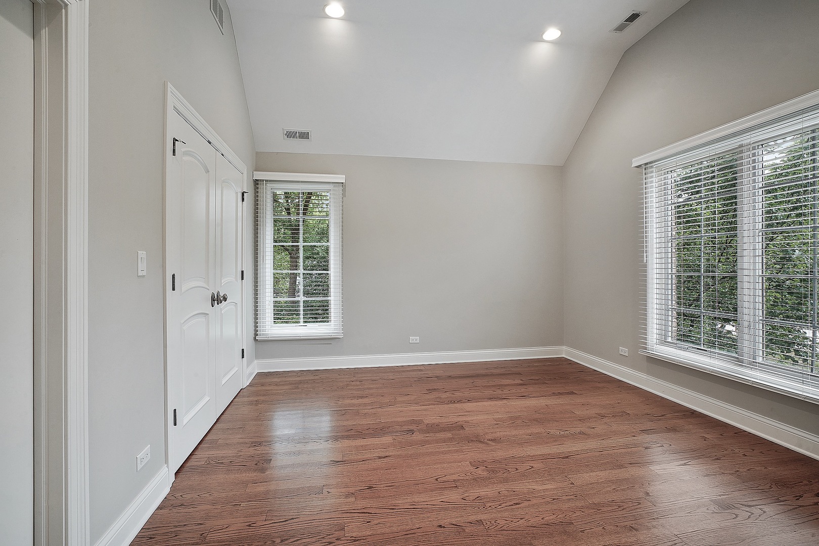 1004 Lee Road Northbrook, IL 60062 - Photo 21 of 30 a view of an empty room with wooden floor and a window