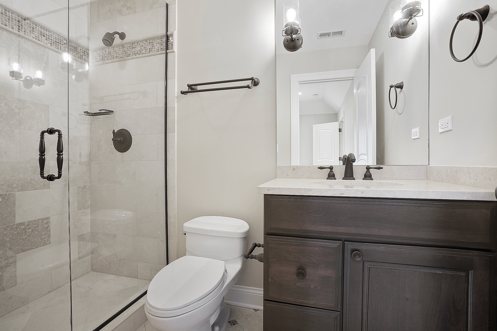 1004 Lee Road Northbrook, IL 60062 - Photo 22 of 30 a bathroom with a sink a toilet and shower
