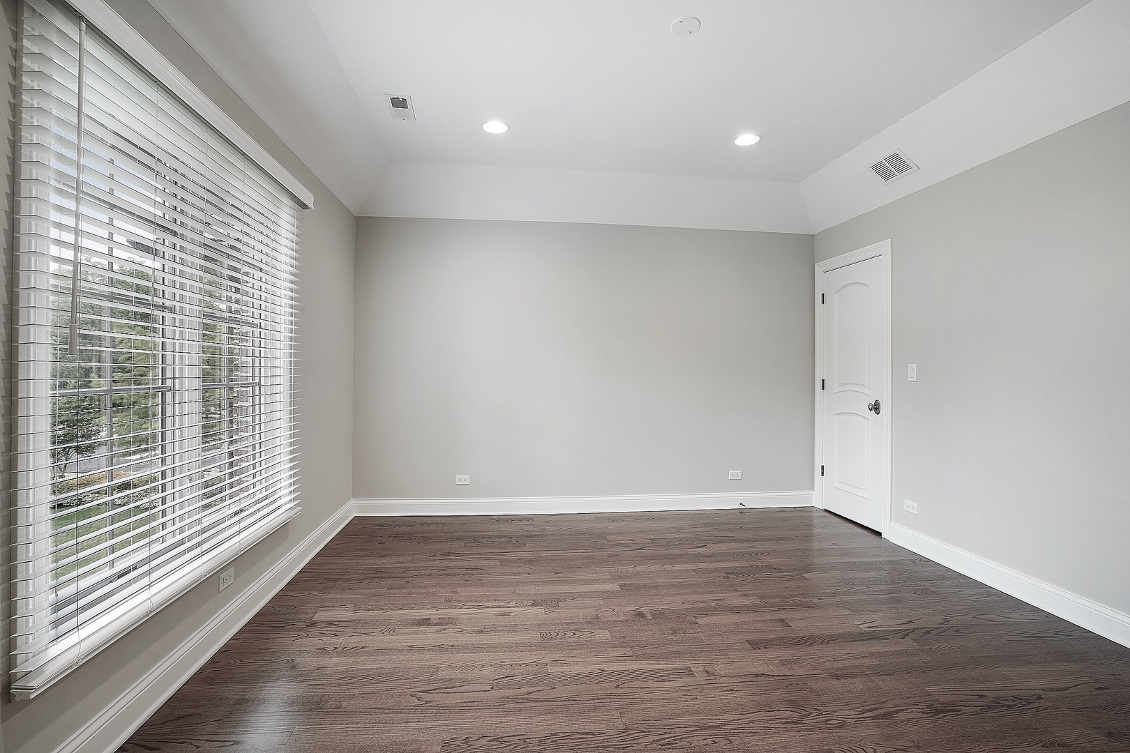 1004 Lee Road Northbrook, IL 60062 - Photo 23 of 30 a view of an empty room with wooden floor and a window