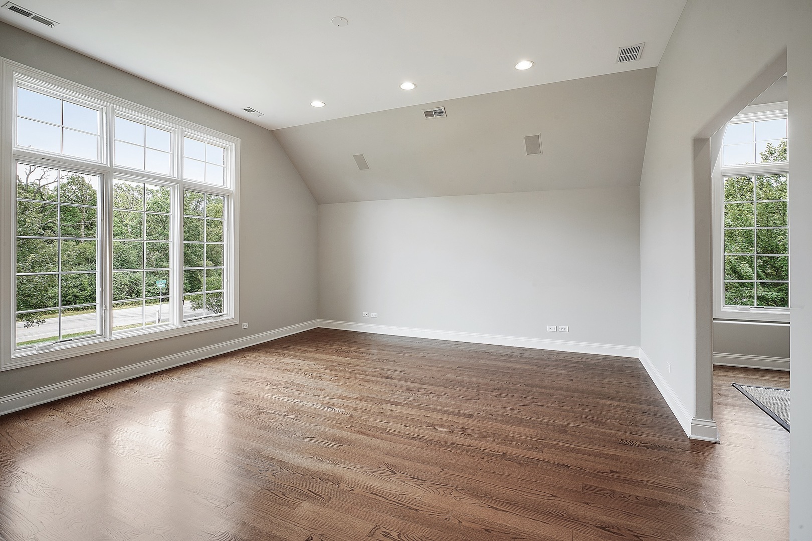 1004 Lee Road Northbrook, IL 60062 - Photo 26 of 30 a view of an empty room with wooden floor and a window