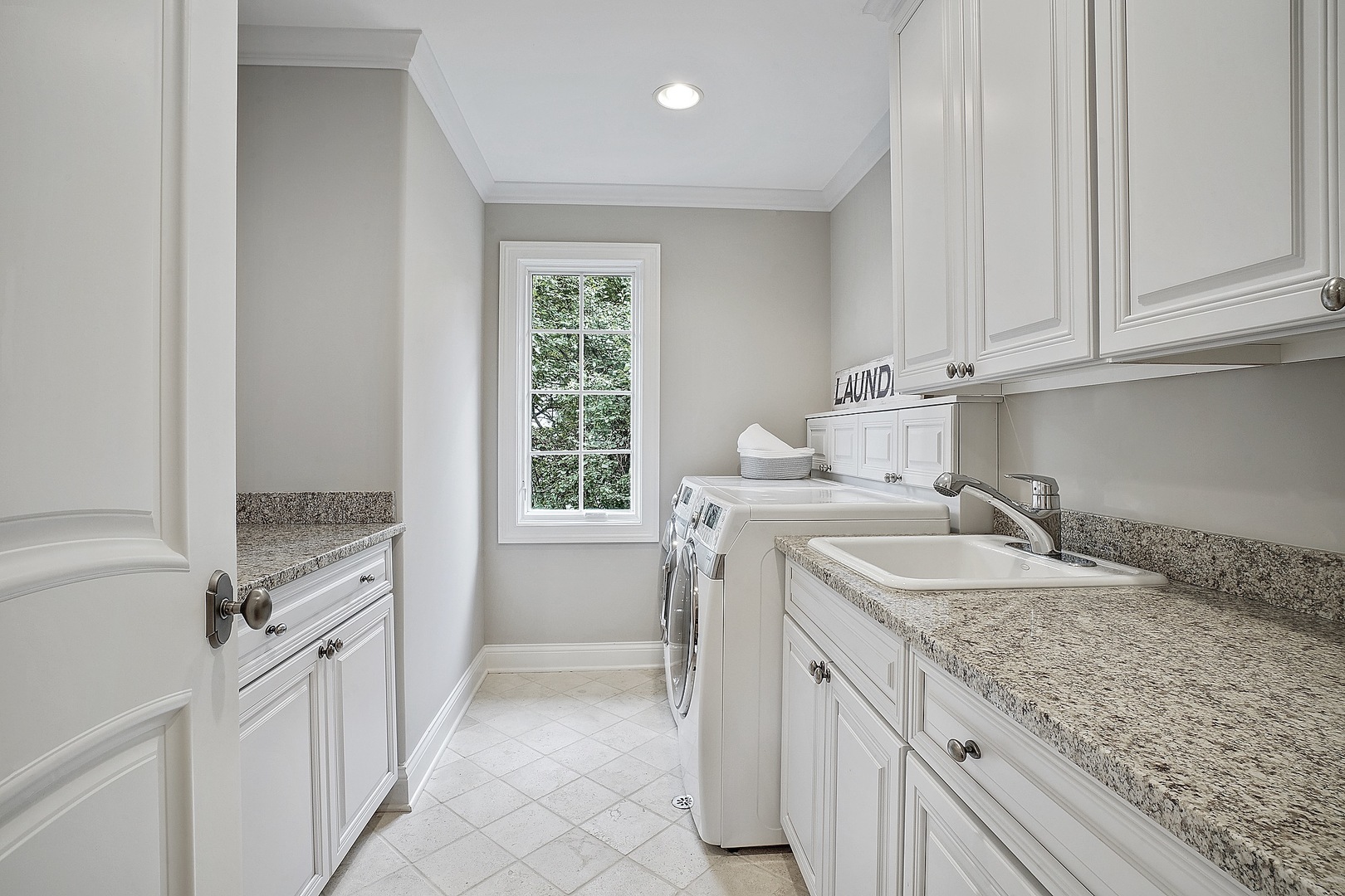 1004 Lee Road Northbrook, IL 60062 - Photo 27 of 30 a kitchen with granite countertop a sink stove and cabinets