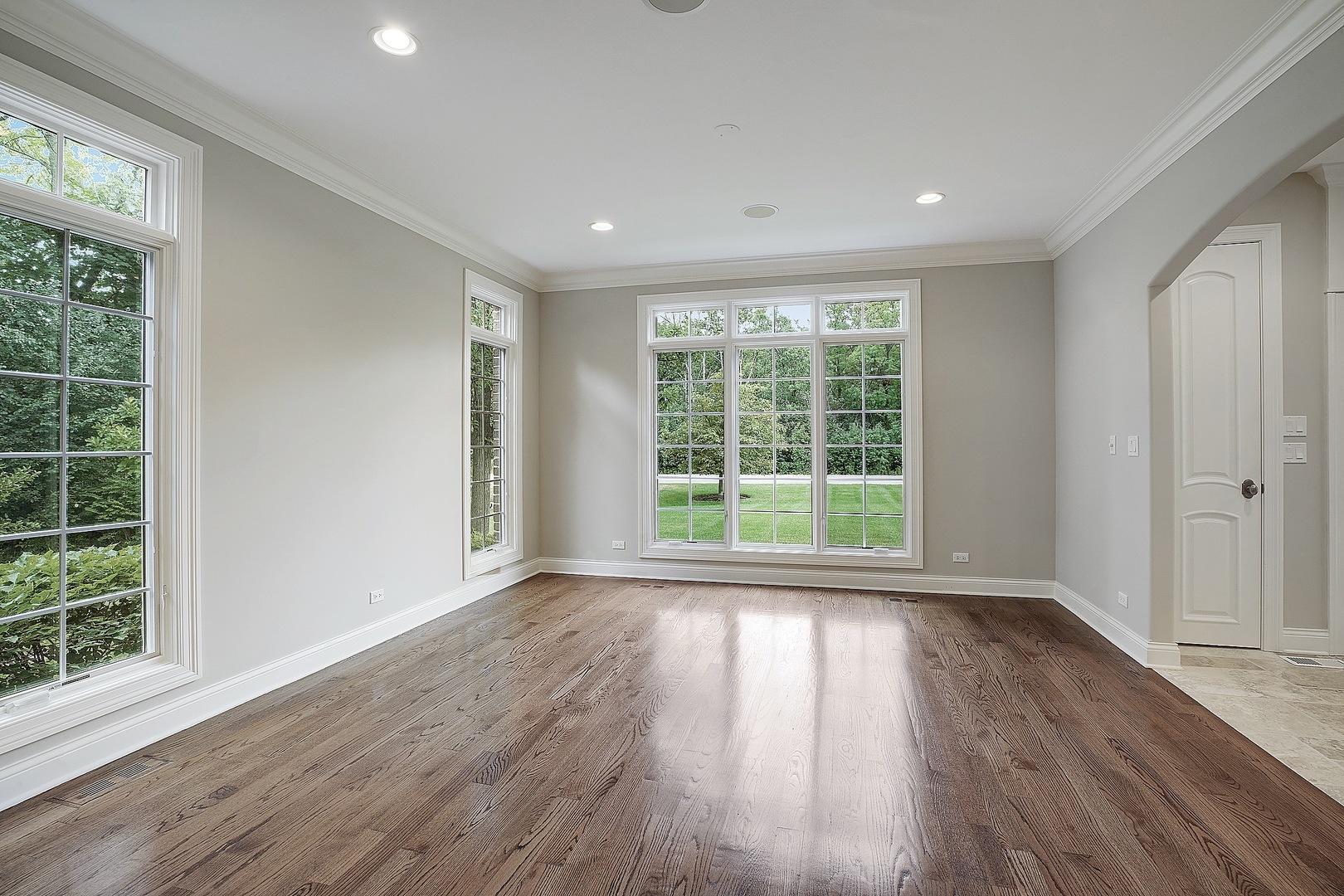 1004 Lee Road Northbrook, IL 60062 - Photo 5 of 30 a view of empty room with wooden floor and fan