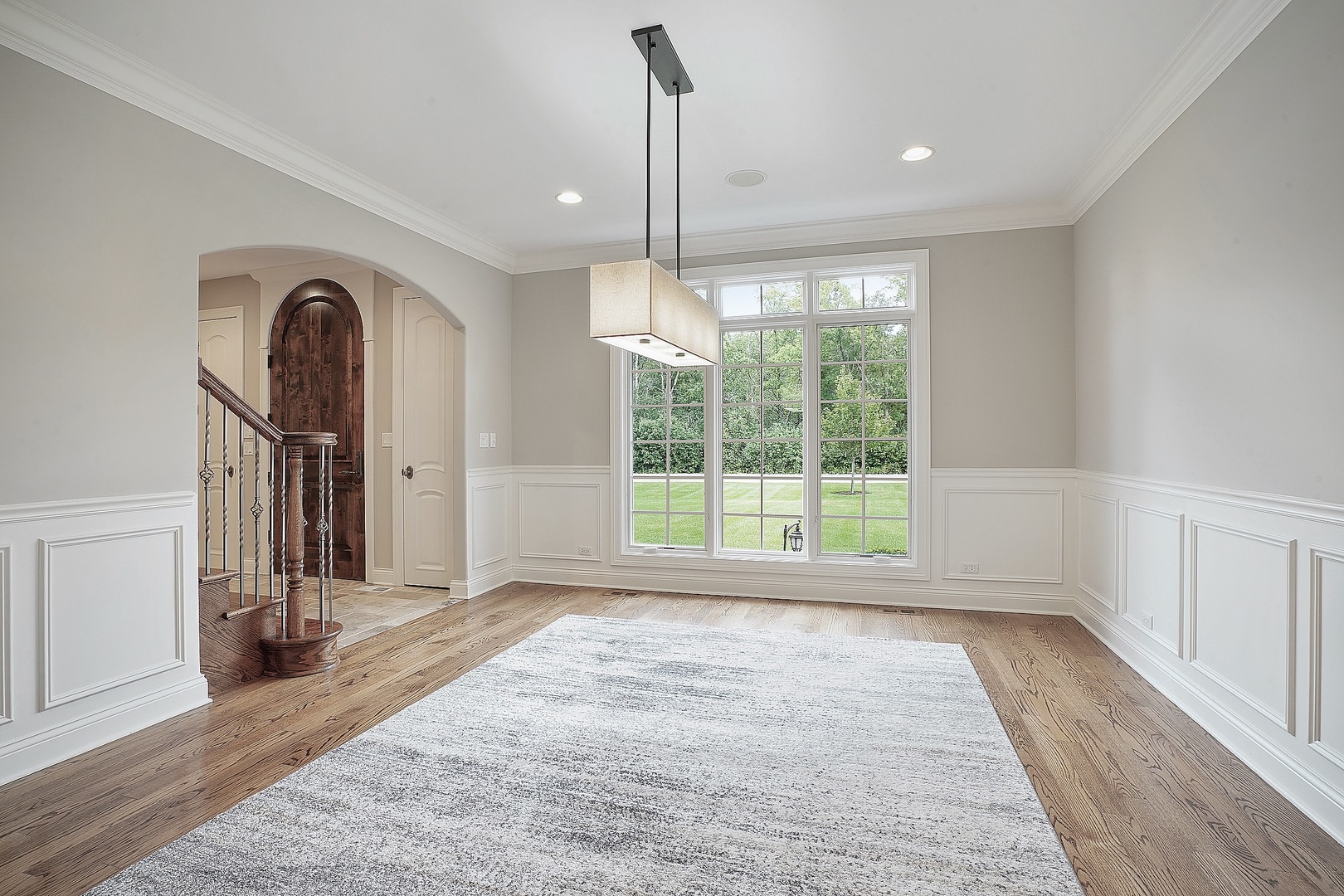 1004 Lee Road Northbrook, IL 60062 - Photo 7 of 30 a view of a room with large windows and wooden floor