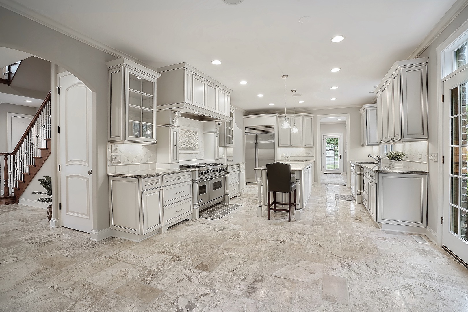 1004 Lee Road Northbrook, IL 60062 - Photo 10 of 30 a kitchen with white cabinets and stainless steel appliances
