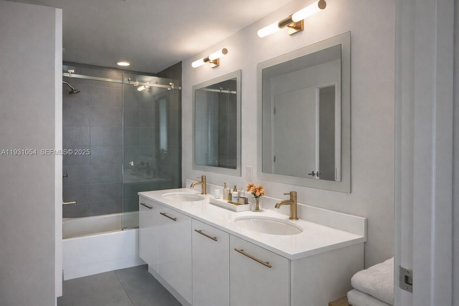 92 Southwest 3rd Street, Unit 1408 Miami, FL 33130 - Photo 6 of 15 a bathroom with a sink double vanity mirror and a bathtub