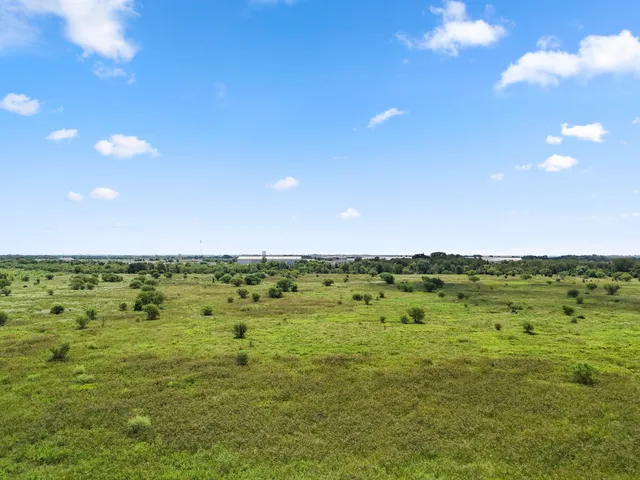 a view of an ocean and a yard