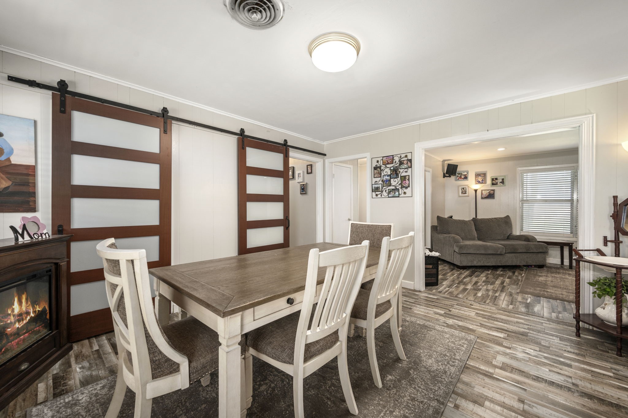 9919 Bohacek Road Beasley, TX 77417 - Photo 7 of 46 a view of a dining room with furniture and wooden floor