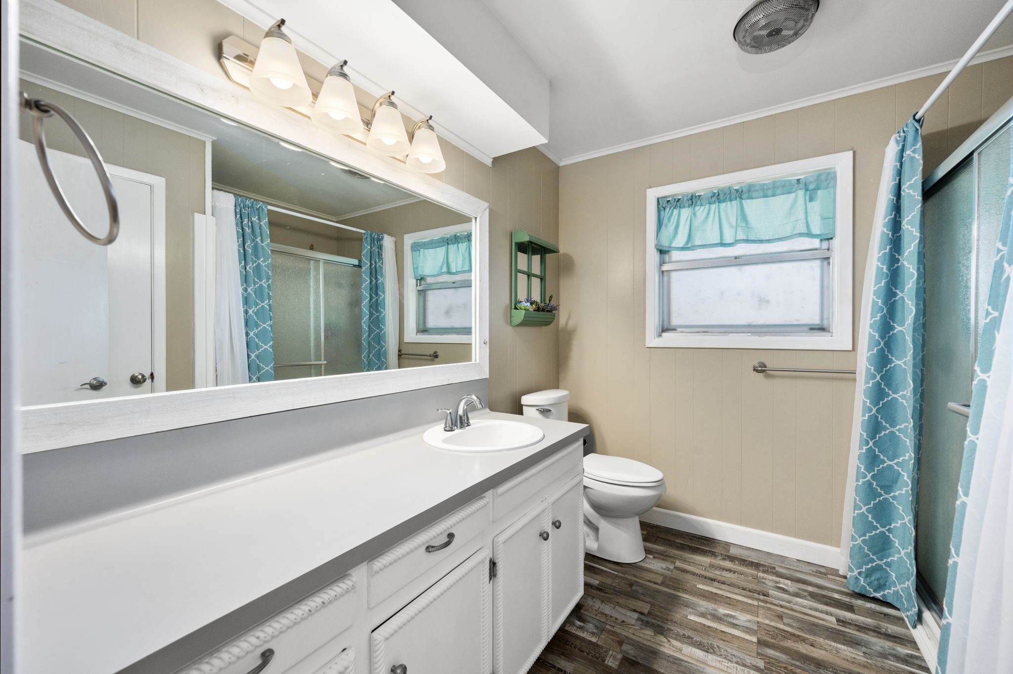 9919 Bohacek Road Beasley, TX 77417 - Photo 9 of 46 a bathroom with a double vanity sink and a mirror