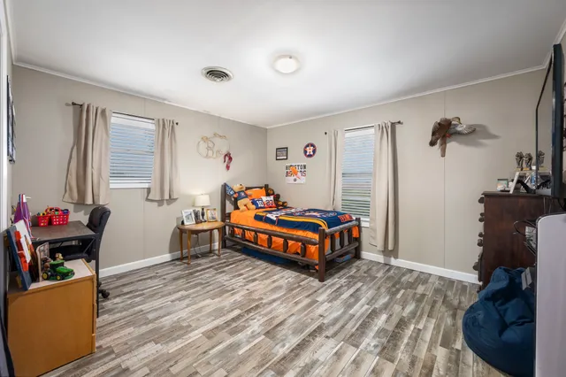 a bedroom with a bed and a dresser